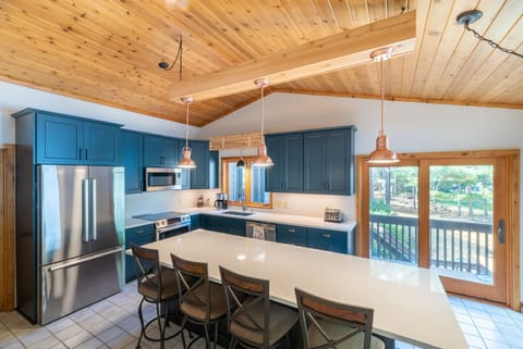 Remodeled kitchen. Large island, quartz countertops. Stainless steel appliances.