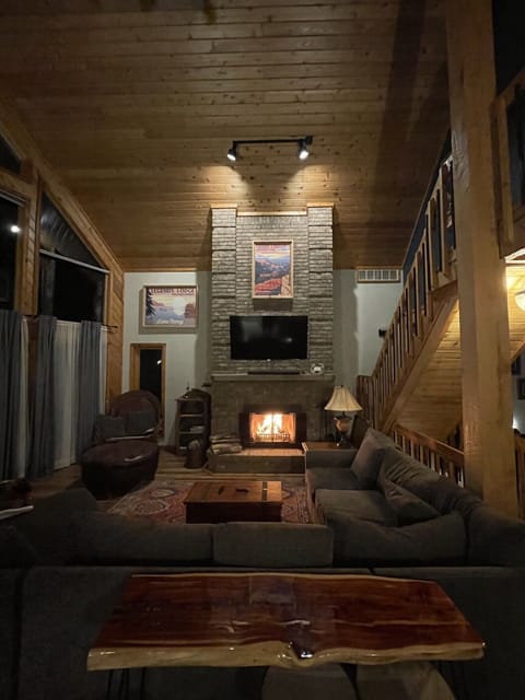 Great room with cozy fireplace. Seating for many, close to the kitchen.

