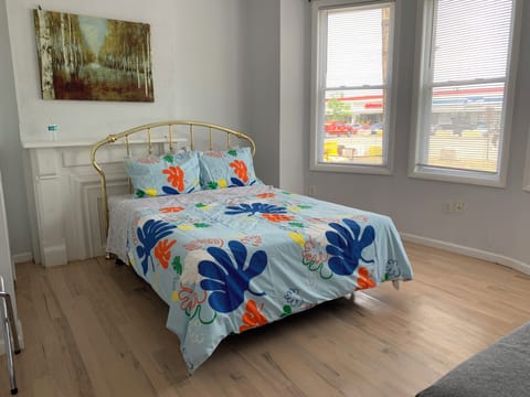 Main bedroom has queen size mattress and a decorative fireplace.