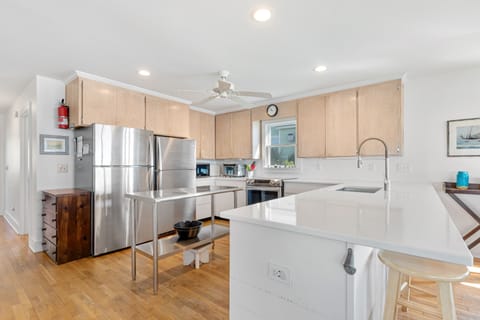 Two full sized refrigerators with freezers, dishwasher.