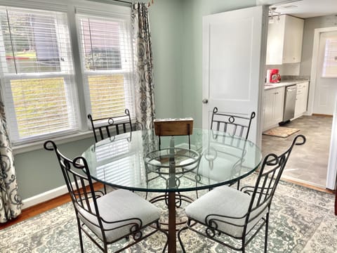 Dining room is directly off the kitchen with plenty of afternoon sunlight. 