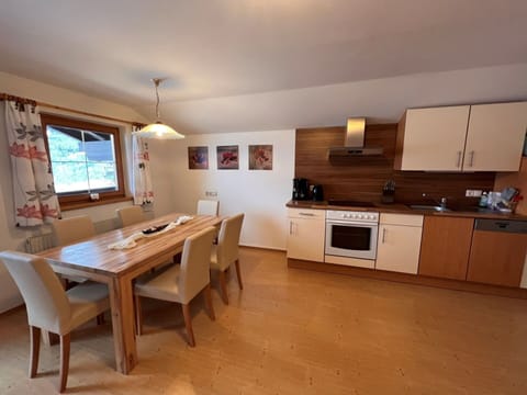 Furniture, Property, Table, Cabinetry, Building, Countertop, Window, Wood, Kitchen, Flooring