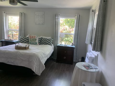 Enjoy a nice cozy bed, impact windows, dressers & nice outside landscaping.