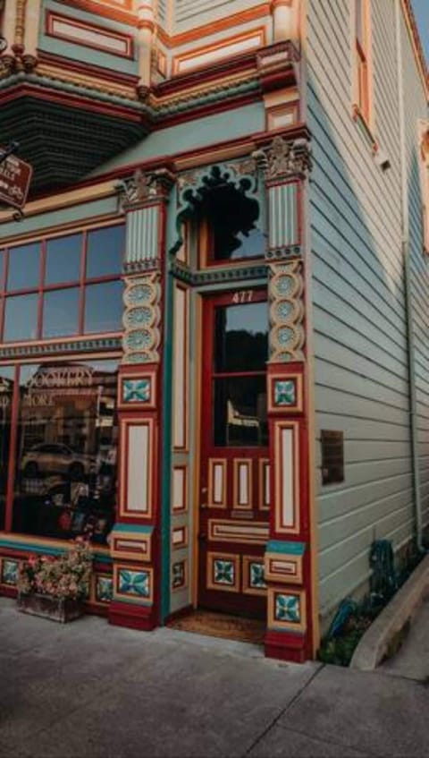 Entrance on the right of the building.  Apartment is upstairs.