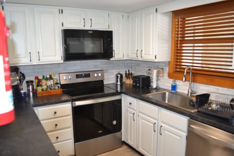 Kitchen fully stocked, renovated,  new appliances, microwave, coffee pots, etc.