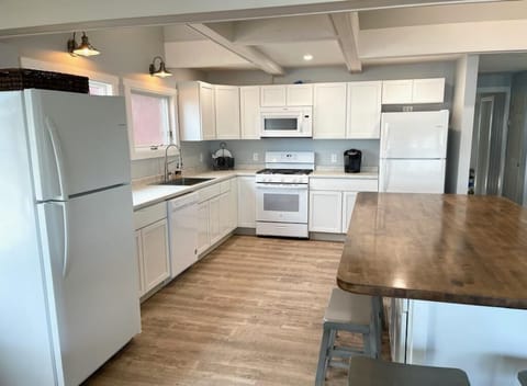 Great room-kitchen, large island, two fridges