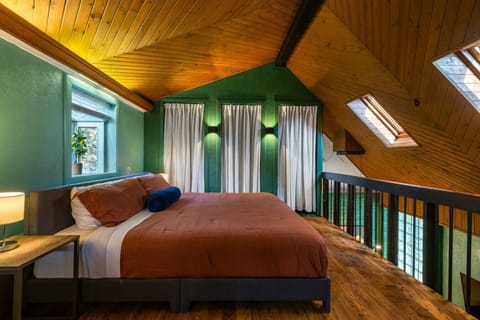 Romantic, architectural, and serene—fall asleep under the soft glow of skylights and wake up to a beautifully structured wooden canopy.