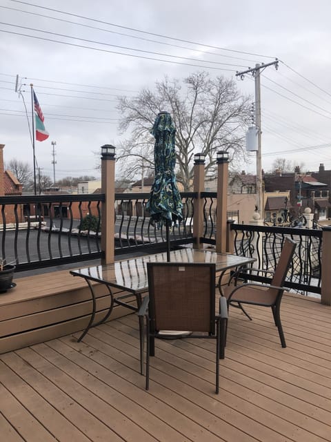 Furnished deck overlooking piazza and gelateria courtyard.