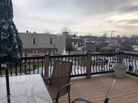 Furnished deck overlooking piazza and gelateria courtyard.