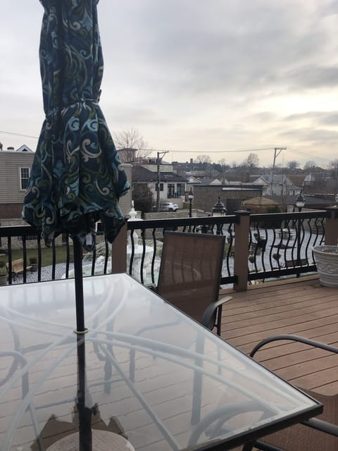 Furnished deck overlooking piazza and gelateria courtyard.