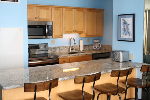 Fully stocked kitchen with new stainless steel appliances 