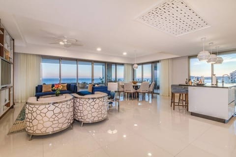 Huge floor to ceiling windows and doors on 2 sides lead to your private terrace.