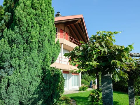 Plant, Sky, Property, Building, Tree, Grass, Cottage, Shrub, Evergreen, Landscape