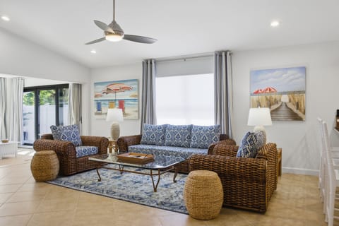 Spacious formal living room with 75" smart TV