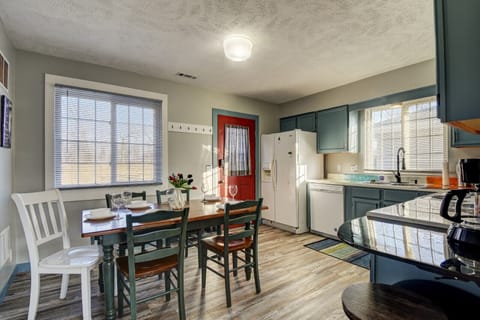 Kitchen with all basic cooking supplies with the main entrance