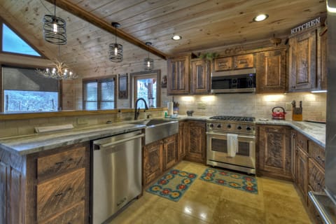Whisky Creek Retreat-Kitchen area with rustic cabinet decor