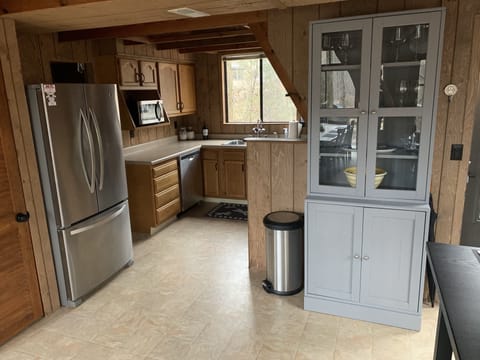 Cabinet with wine glasses and serving plates