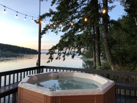 Relax in the private hot tub overlooking the gorgeous bay views.