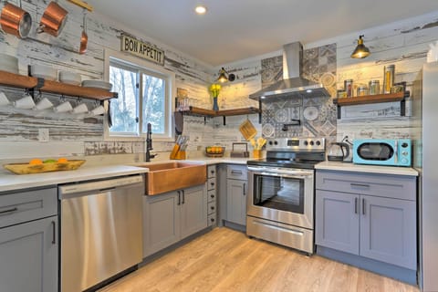 French chateau-style kitchen with copper farm sink