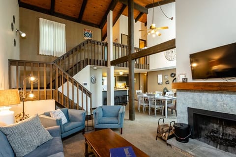 Living Room with high vaulted ceilings and fireplace