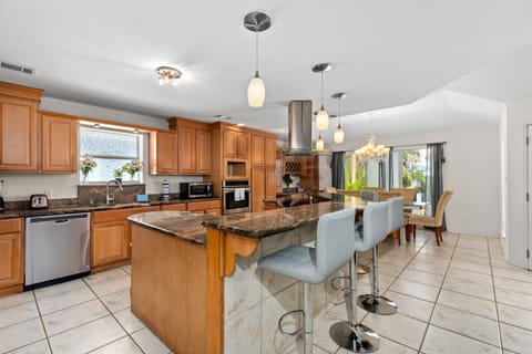 Fully stocked Kitchen area with extra bar space!