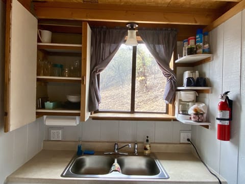 Includes glassware, dishes, pots, pans, coffee, creamer, and sugar