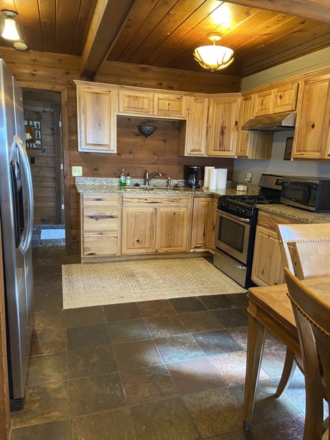 Full kitchen with pots, pans, and dishes