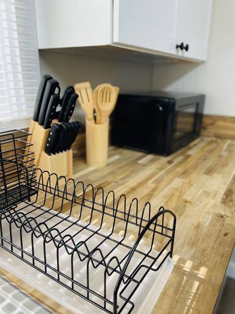 Fully stocked kitchen including microwave, dishes and pots/pans.
