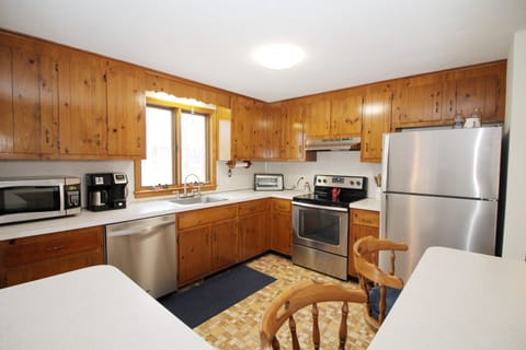 Kitchen has stainless appliances and an island