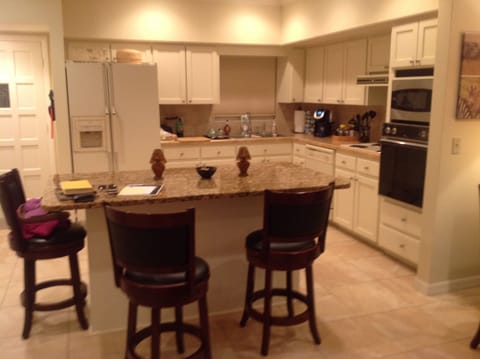 Renovated kitchen with sit at island.