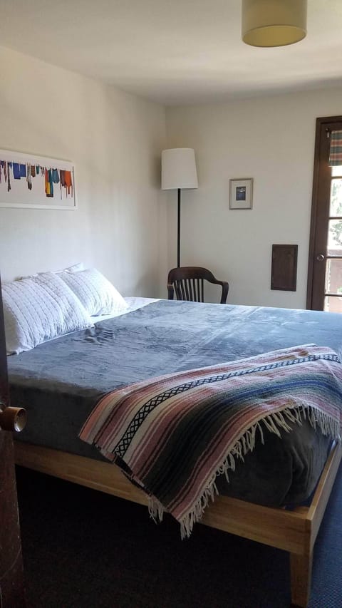 Bedroom # 2, sleeps 2, King bed, sink, balcony, Beds shown with rented bedding. 