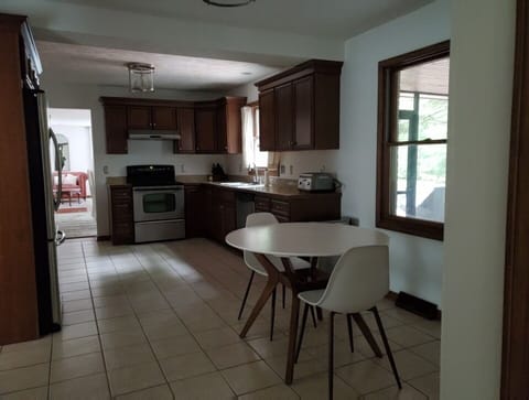 Fully stocked kitchen with dinning for four & eight in dining room