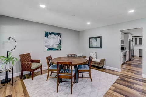 Living Area with Flat Screen TV, Gas Log Fireplace, and Breakfast Table with Seating for Four