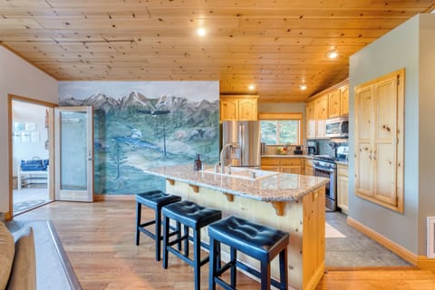 Double sink and barstool seating.