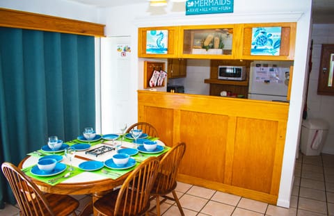 Dining area for six people, complete with full silverware and dining sets