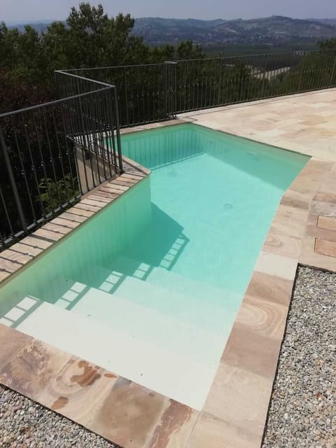 Uniquely shaped pool alongside the terrace with stunning views towards Mon Viso,