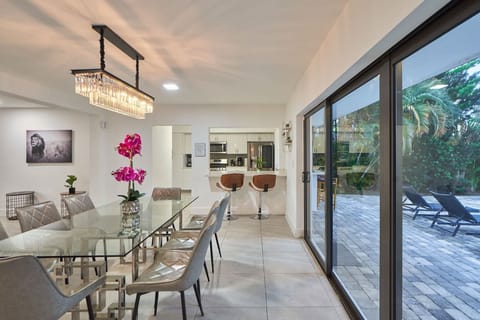 Elegant dining table next to the backyard..