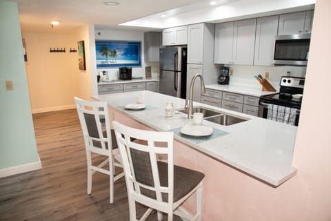 Full kitchen looking toward the entry hallway