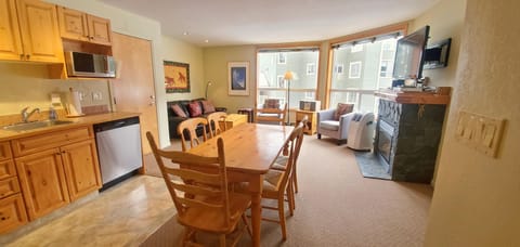 Open plan kitchen, dining, and living