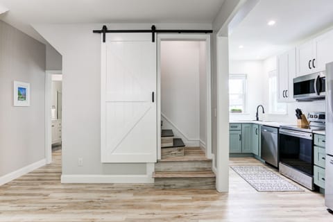 Barn door lead to upstairs master bedroom and bathroom.