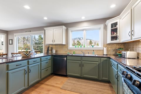 Spacious kitchen with lots of counter space for meal prep and serving.