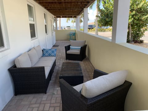 Private outdoor living room, & two-top dining table for beach adjacent relaxing!