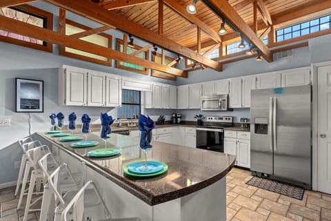 Spacious kitchen - fully-stocked & well-appointed for your stay. Stainless steel appliances and breakfast bar seats 6.