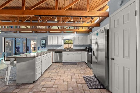 Spacious kitchen - fully-stocked & well-appointed for your stay. Stainless steel appliances and breakfast bar seats 6.