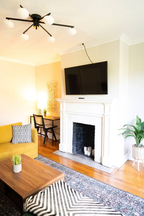 Decorated workspace with a TV nearby for breaks and inspiration.