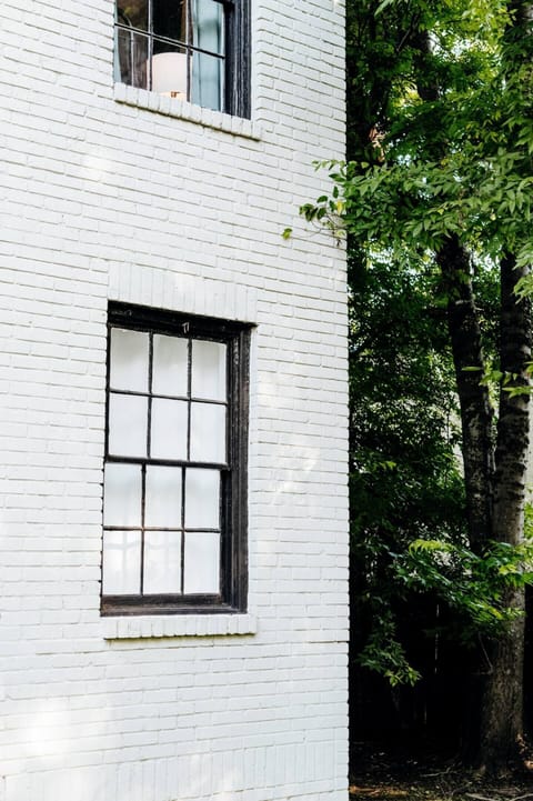 Windows that bring the outdoors in, with tree views and natural light.