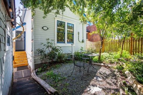 Historic Victorian era cottage nestled under hawthorne and cherry trees

