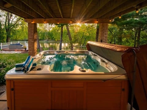 Enjoy the views of the river from the hot tub that seats 6 to 7 people. 