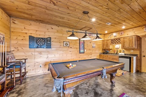 Pool table, darts, and mini bar