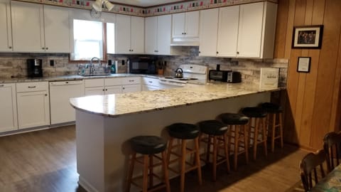 Lots of counter space and extra seating at counter overhang.